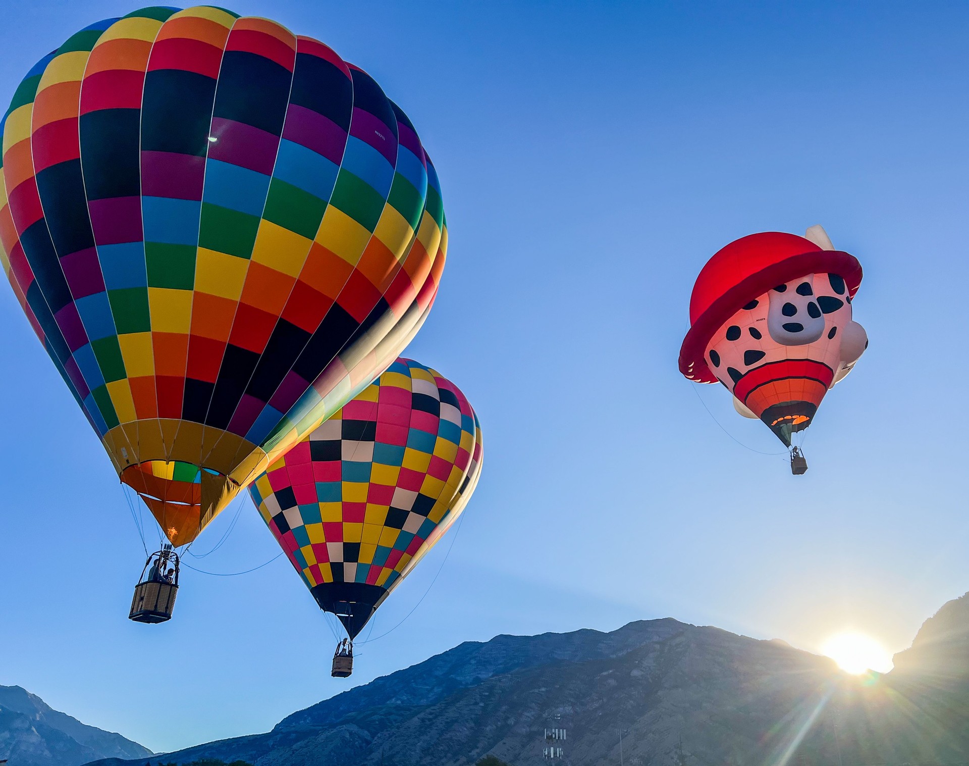 Air balloons taking off during sunrise